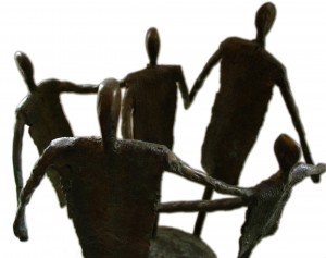 iron figures holding hands